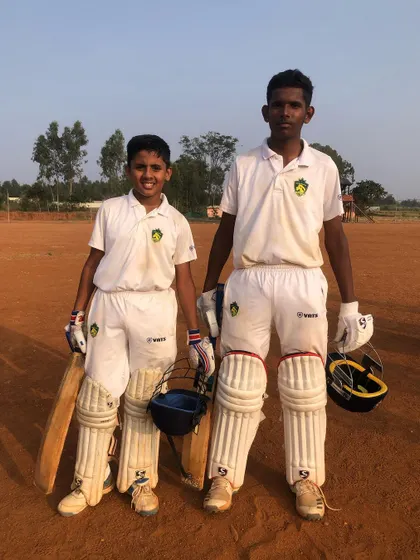Two of our key players after a successful match. Partnerships on the field are crucial, and we encourage our players to support each other.
