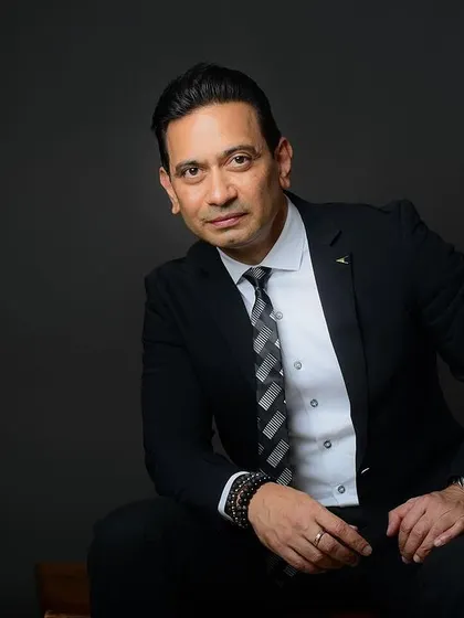 A seated portrait that is direct and engaging. This is a versatile shot that works well for almost any professional use case.
