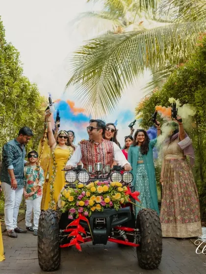 The full view of the couple's colorful Haldi entry, with friends and family setting off smoke bombs.