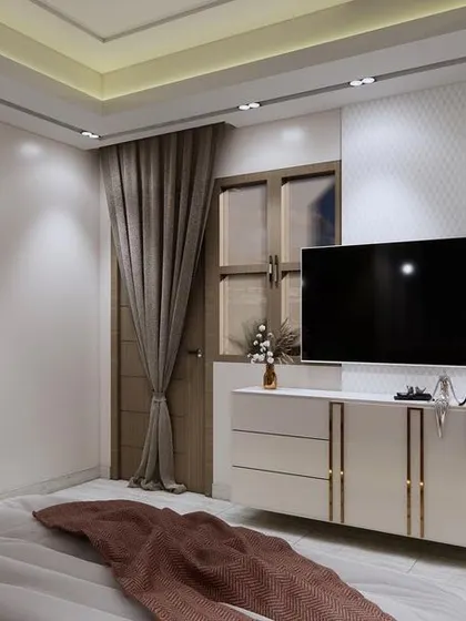 This angle reveals an arched doorway leading to a dressing area, adding a classic architectural element to the modern bedroom. The design is clean and bright, with gold accents for a touch of elegance.