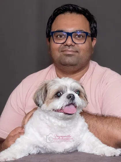 Sushi posing with his dad, looking calm and content.