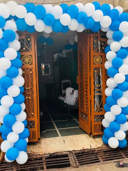 A close-up of the balloon arch at the entrance of the house for the 'Welcome Baby' party.