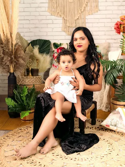 A mother and daughter moment in my favorite boho corner. The rich textures of the rug, pampas grass, and macrame create a warm and inviting atmosphere for this beautiful portrait.