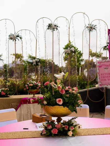 This event shows how I blend different elements for a complete experience. The setup includes elegant floral arrangements, a beautiful backdrop, and a designated spot for return favors, ensuring every aspect of the party is covered.