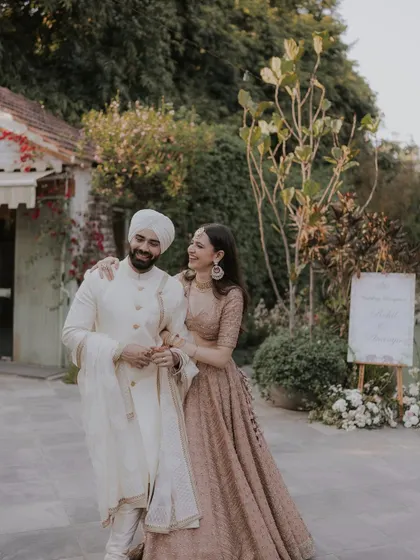 A happy couple walking through the venue, sharing a smile. These are the moments I cherish.
