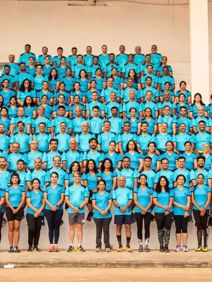A fantastic group photo of our JJs runners, all wearing the team colors. This image captures the scale and unity of our community during the TCSW10K event.