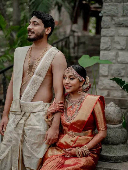 A moment of quiet connection amidst the grandeur of The Tamarind Tree. We love using the venue's stunning architecture to frame our couples, creating a story of romance and tradition.