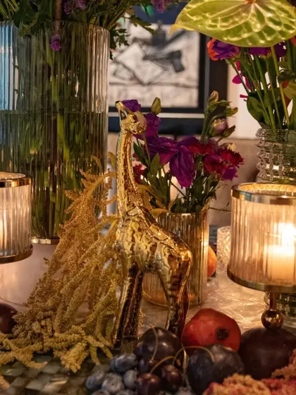 Another whimsical detail, a golden giraffe figurine, adds a playful element to the luxurious tablescape. It's a small touch that sparks conversation and delight.