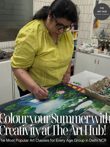 A student is deeply focused on her painting of a lily pond, adding fine details to the water lilies. My classes provide a space for you to immerse yourself in your art.