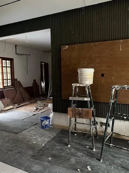 The living room site during construction, showing the bare walls before the final finishes were applied.