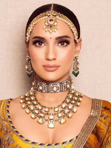A close-up of the Haldi look, showcasing the flawless base and sharp eye makeup. Learn these essential skills in my upcoming pro courses.
