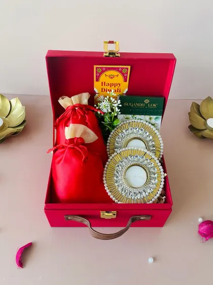 Another angle of our red suitcase hamper, showing the elegant handle and secure clasp. It’s a gift that is both beautiful and practical.