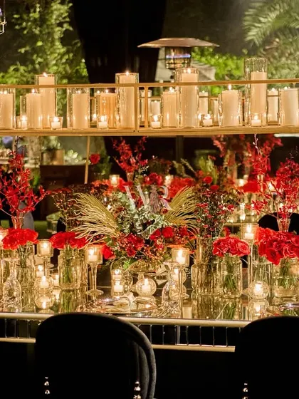 The full length of the head table, showcasing the sheer density of the floral and candle decor. This is how we create a high-impact, luxurious focal point for a reception.