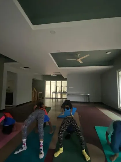 Wheel pose, or Chakrasana, is a favorite among the kids! It's a powerful backbend that builds strength in the arms, legs, and spine, and they love the challenge of lifting themselves up.