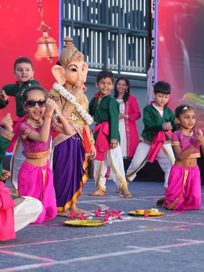 A playful and devotional performance celebrating Lord Ganesha, complete with a child dressed as the beloved deity.