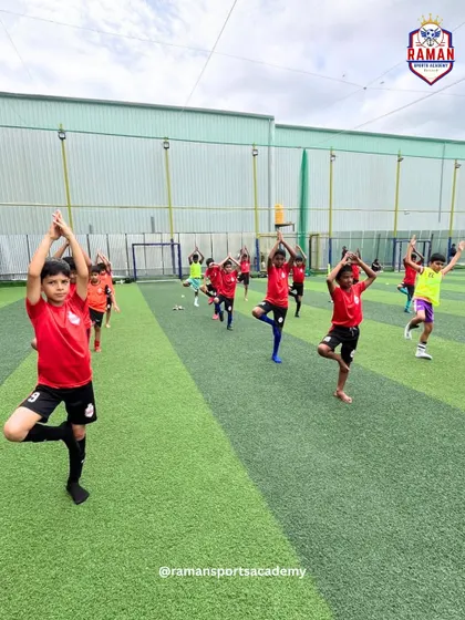 A group of our players practicing yoga together on the turf, connecting mind and body.