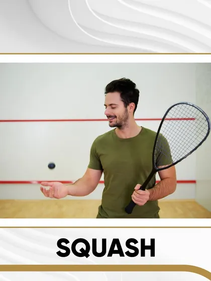 A player getting ready to serve in one of our indoor squash courts. It's a great sport for a high-intensity workout.