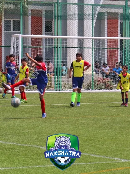 A player practices controlling the ball mid-air. We encourage our players to dream big and work hard to make those dreams a reality.