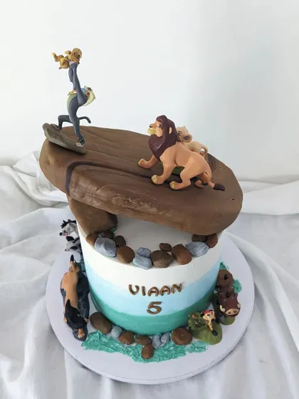 Another angle of the Lion King cake, showing the different characters around the base.