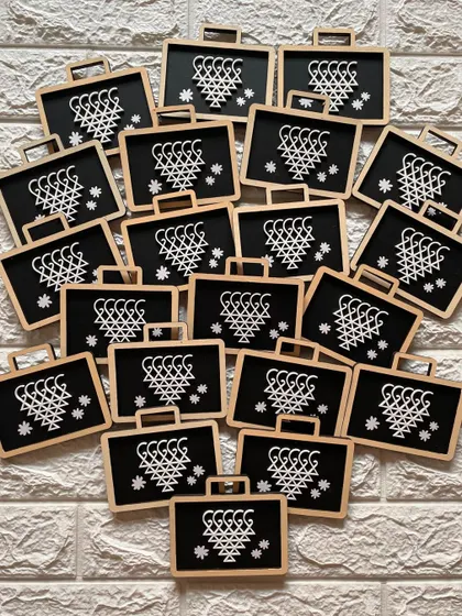 A whole batch of Saraswati Pati magnets, ready to be shared as tokens of knowledge and blessings.
