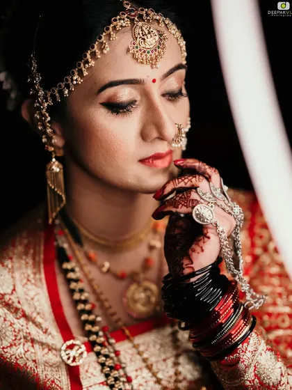 A quiet moment of reflection. Here you can see the side view of the matha patti and the traditional earrings.