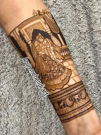 A beautiful depiction of Radha and Krishna, symbolizing divine love. This is a popular and auspicious choice for bridal mehendi.
