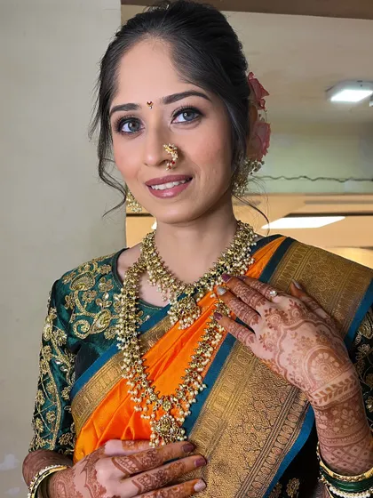 My bride Priyanka, whose real eyes are the star of the show. I used soft brown and gold eyeshadow to enhance their natural beauty.
