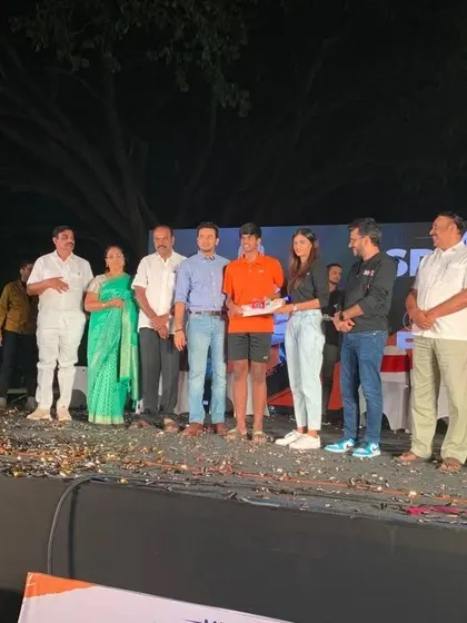 Our U17 player Sreyas on stage receiving his winner's trophy and prize at the prestigious MP Sports Utsav.
