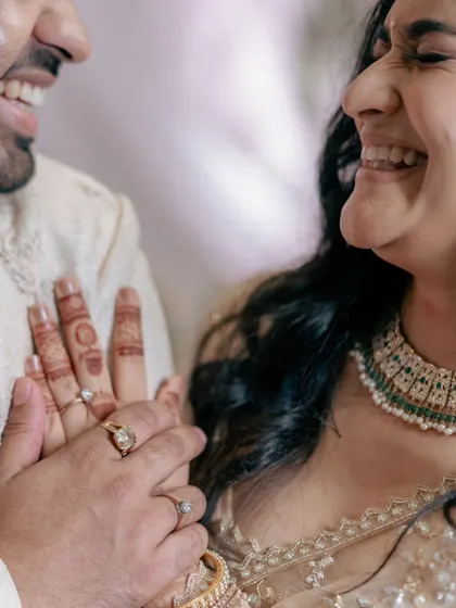 A repeat of the joyful close-up after the ring exchange, emphasizing the happiness and connection of the moment.