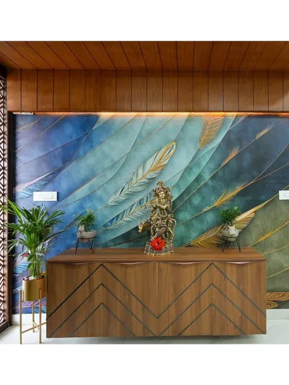A full view of the feather mural wall, showing how it serves as a stunning backdrop for the entryway. The wooden ceiling and geometric screen add warmth and structure, framing the artwork beautifully.