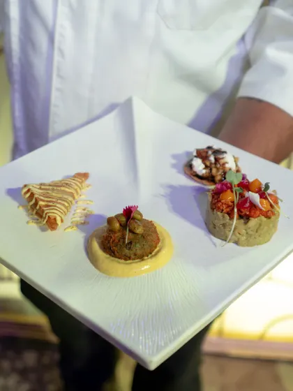 A sampler plate showcasing four distinct creations. Each bite is a unique journey of flavour, from a savory kebab to a crisp tartlet, demonstrating the breadth and creativity of our canapé menu.
