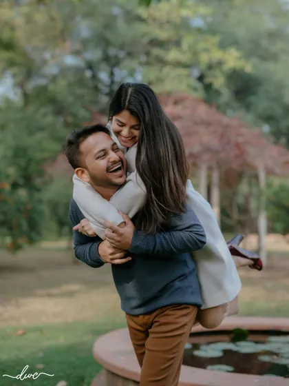 Pure happiness captured in a piggyback ride. This fun and candid moment from a pre-wedding shoot perfectly shows the couple's joyful connection.