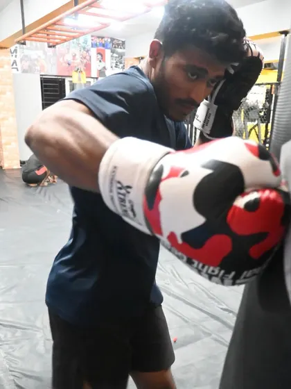 A student working on his punches with the heavy bag. Every session is an opportunity to get stronger and more technical.