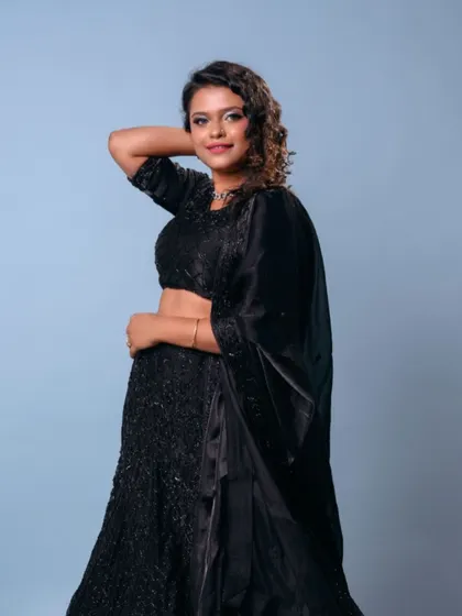Another angle of the black lehenga, showing off its beautiful design. It's a sophisticated and elegant choice for an evening event.