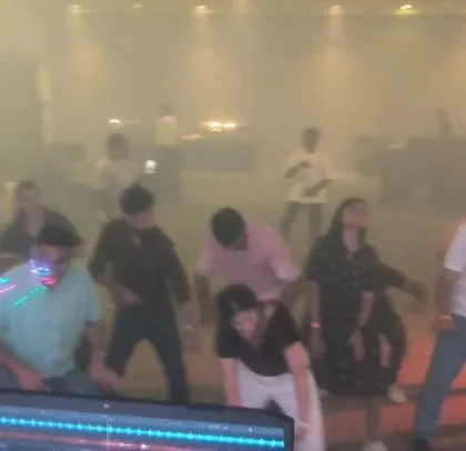 Employees doing a coordinated dance move, led from my DJ console.