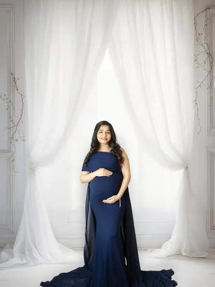 A subtle and elegant background edit. The addition of a window and soft curtains adds depth and a touch of romance to the original portrait.