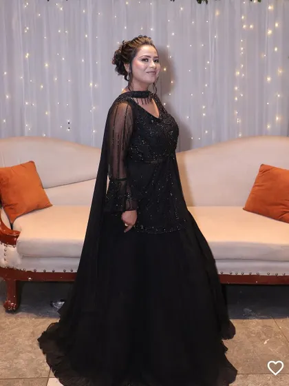 A client looking chic in a black peplum-style lehenga. This is a great rental option for wedding guests who want a comfortable yet stylish ethnic outfit.