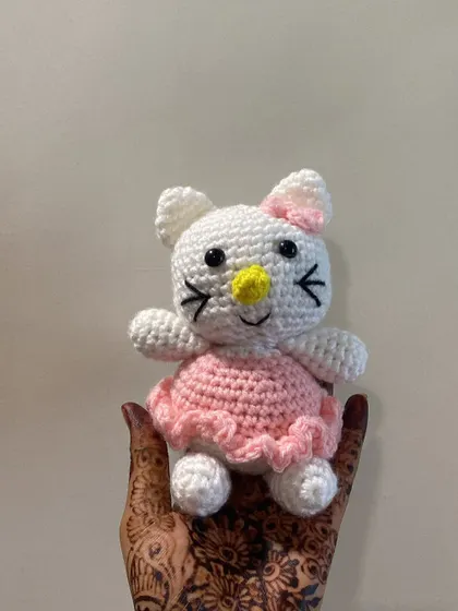 This Hello Kitty amigurumi is resting on my hand, which is decorated with henna. It’s a beautiful mix of my art and my culture.