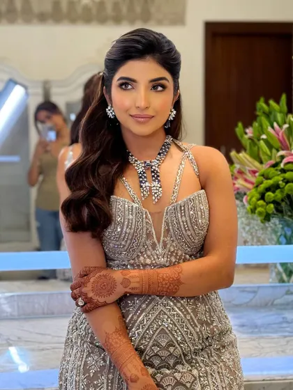 This candid shot shows how the reception makeup looks stunning from every angle, with a beautiful glow on the skin.