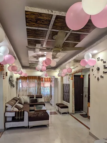 Another angle of the living room, showing how the scattered balloon bunches on the ceiling add a touch of celebration to the entire space.