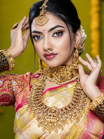 A close-up of another one of my beautiful clients. She is wearing a full temple jewellery set with a peacock and goddess motif, which is a very popular choice for muhurtham ceremonies.