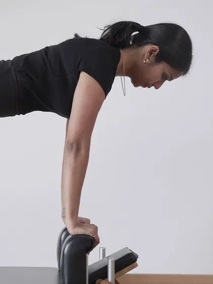 This shot captures the intense focus required for this upper body exercise. It's a moment of pure concentration, where the mind is fully connected to the body's movement.