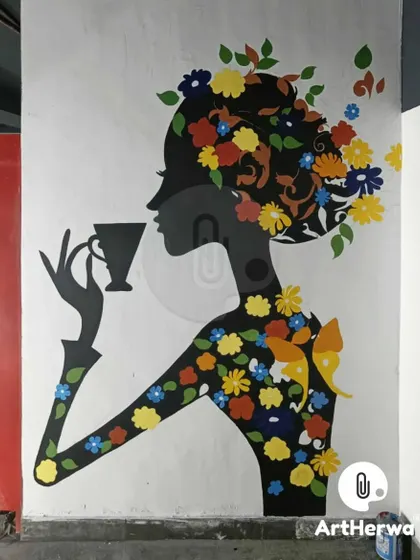 A silhouette of a woman adorned with colorful flowers, enjoying a cup of tea. This elegant and artistic mural was created for a client in Dehradun to add a touch of beauty to their space.