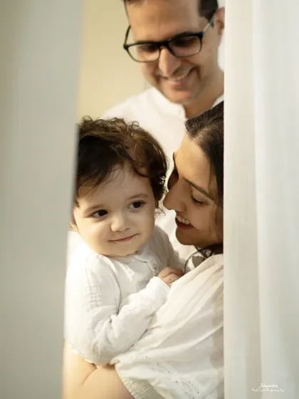 Peeking through the doorway, we see a family lost in their own little world. These are the unposed, in-between moments that hold so much emotion.