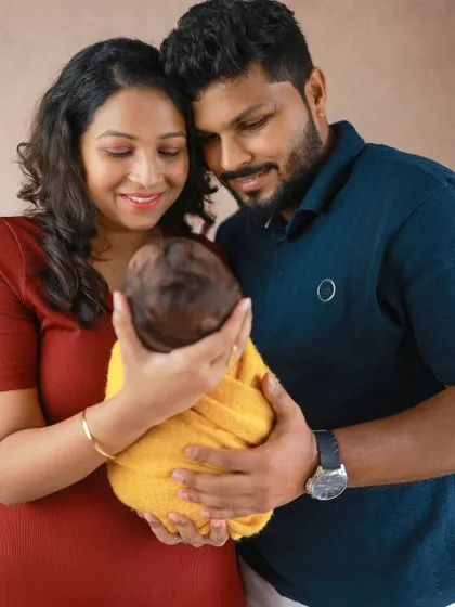 A portrait of the new family, focused on the precious bundle they hold in their hands. It’s a beautiful way to remember just how small your baby once was.