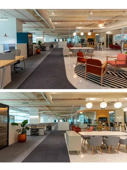 A modern office interior that balances open workstations with enclosed phone booths and breakout areas. The design uses a mix of flooring and furniture to define different zones, supporting both focused work and collaborative activities.