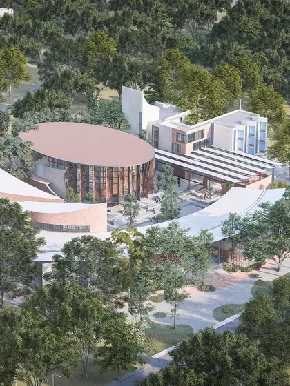 An aerial perspective of the Centre for Excellence, showing how the entire complex is nestled within a dense green landscape. This demonstrates our commitment to preserving and enhancing the natural context of our projects.