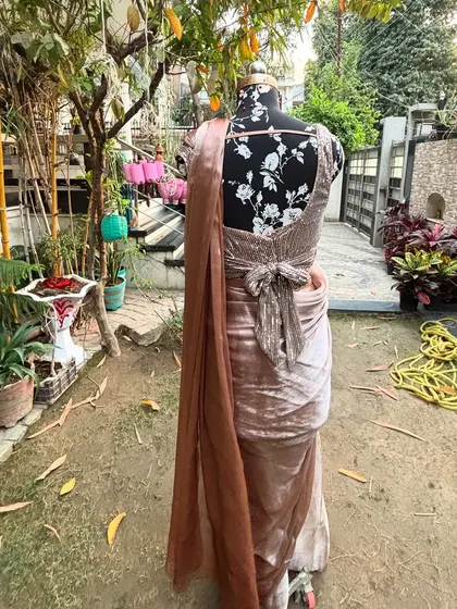 The back view of the 'SAJEELI' saree, highlighting the unique bow detail on the sequined blouse. It’s all about those little details.