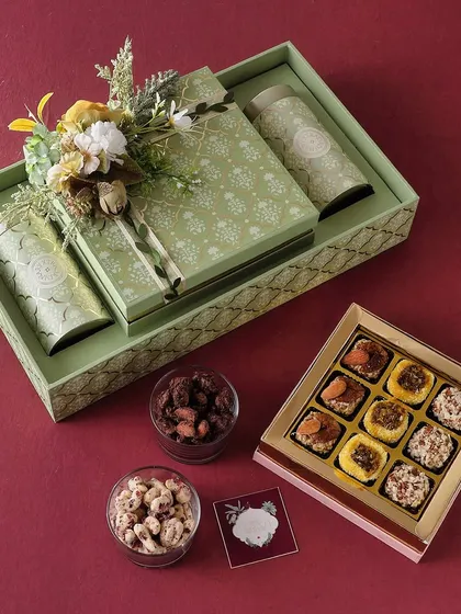 The Green Aura hamper is a fresh and flavorful Diwali gift. It comes with our Mexican Trail Mix, Mini Butter Cookies, and a box of 16 assorted chocolates.