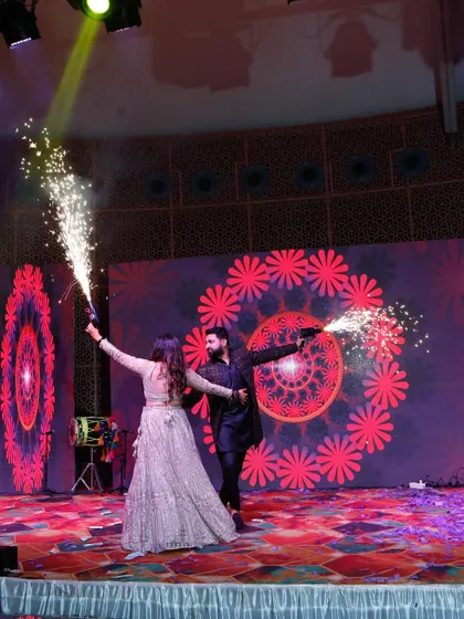 Using props like cold pyro guns can add a huge element of surprise and fun to a couple's performance. It's a great way to get the crowd hyped up.
